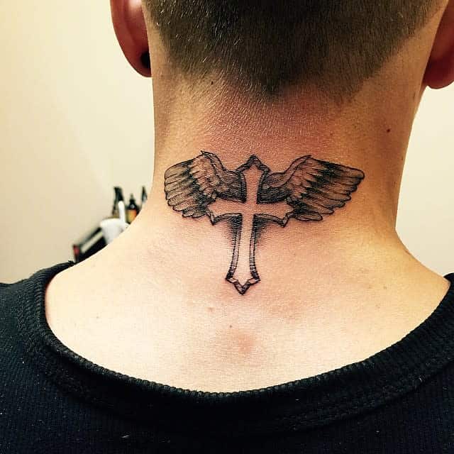 Tattoo of a cross with wings on the back of neck