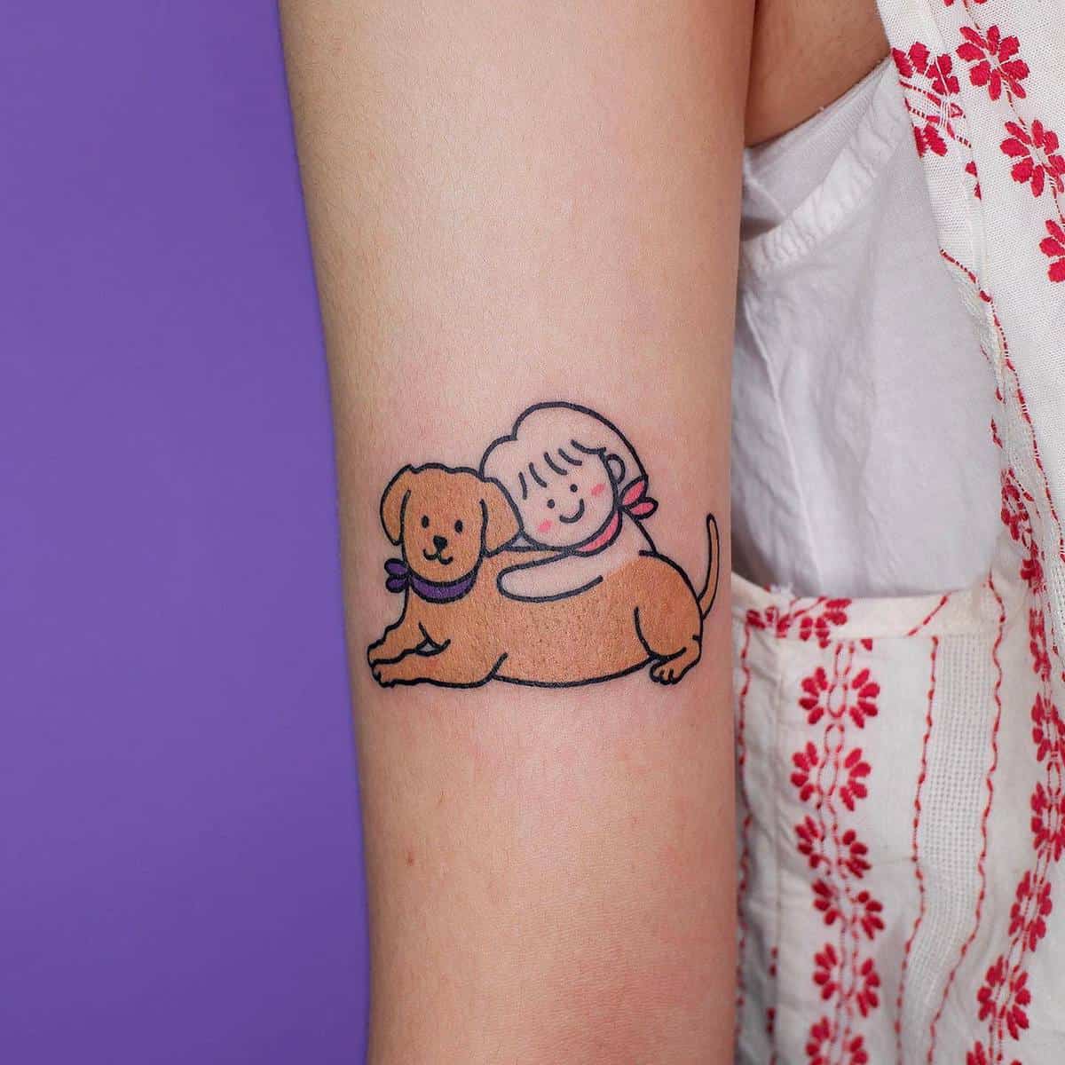 Cartoon tattoo of a child with a dog on an arm