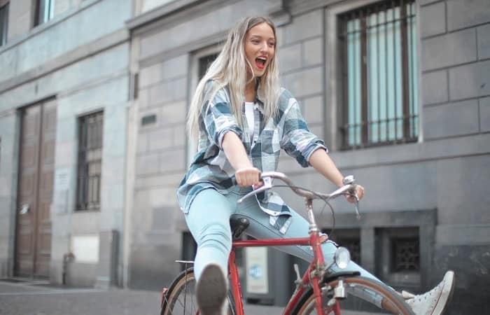 Girl Riding Bicycle In City