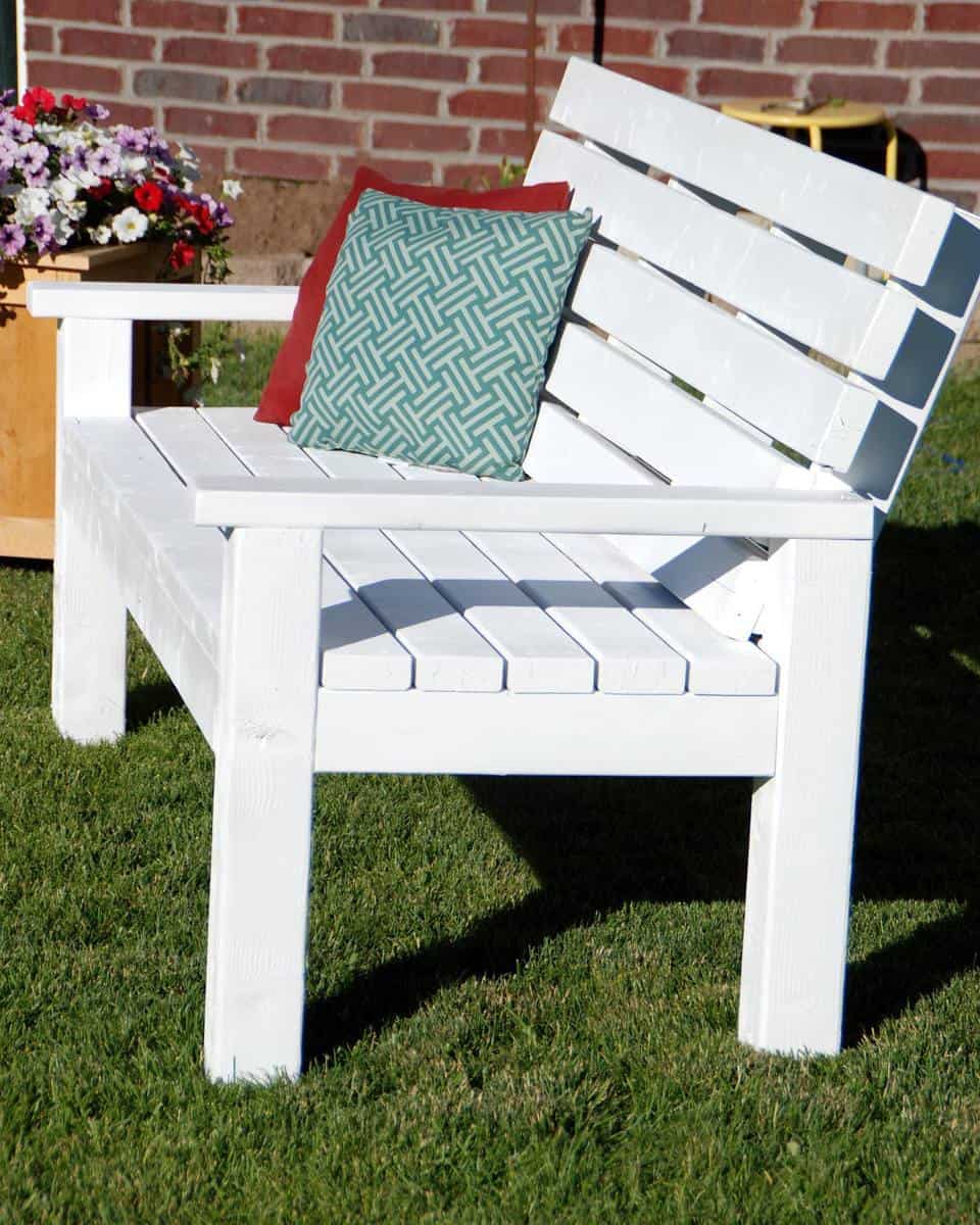 painted white wood bench with pillows