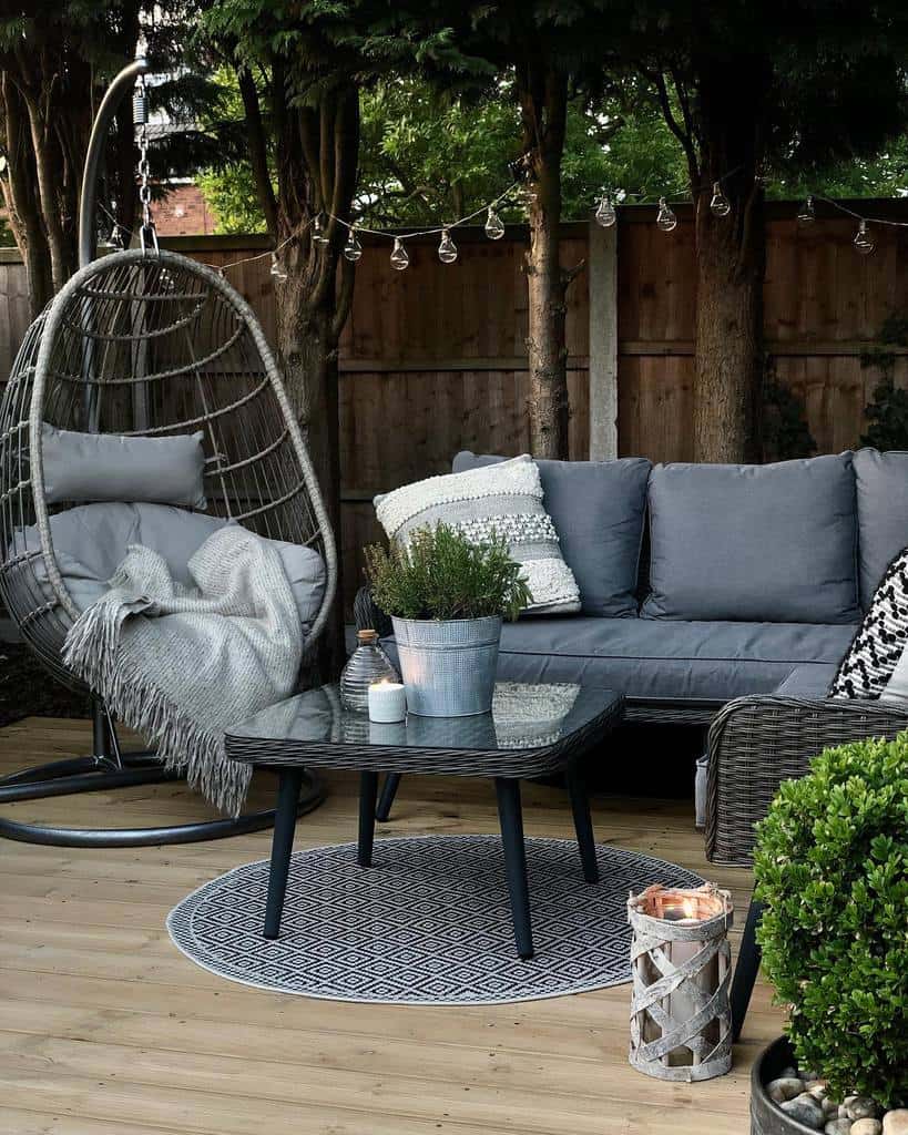 small wood patio with wicker furniture 
