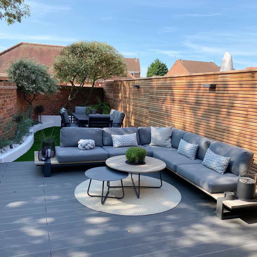 large backyard wood patio garden with l-shape sofa