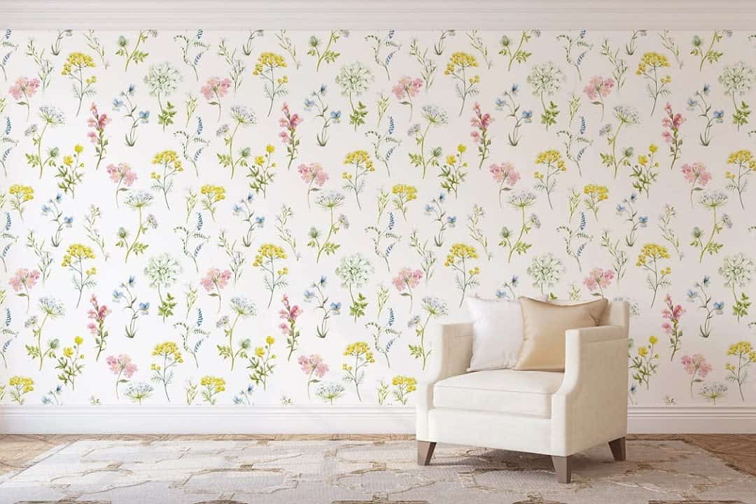 floral wallpaper living room with white accent chair
