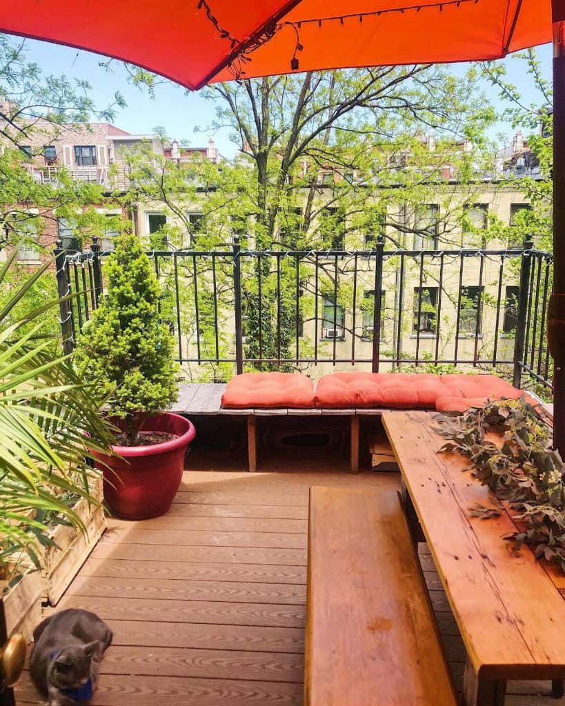 balcony deck patio with park bench 