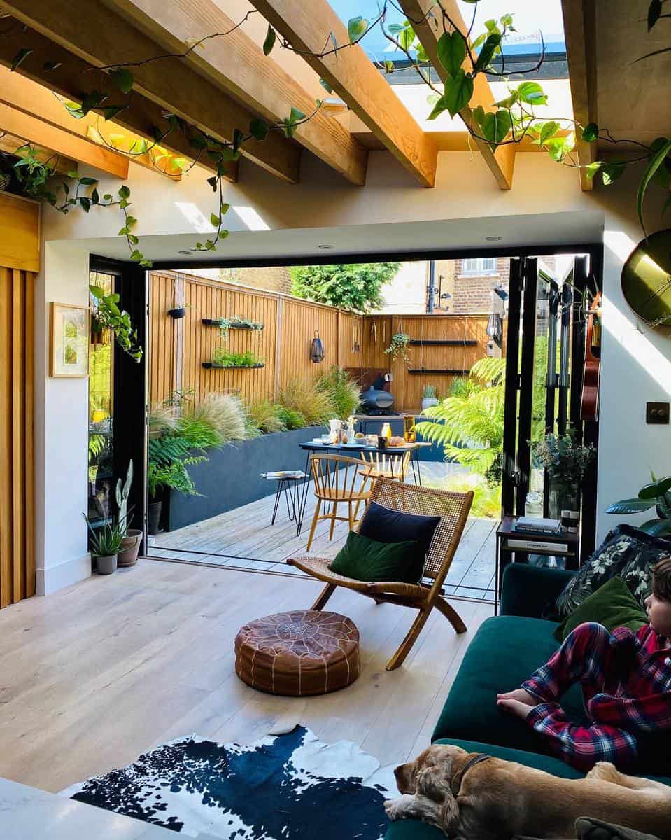 small outdoor deck wood fence open doors to patio 