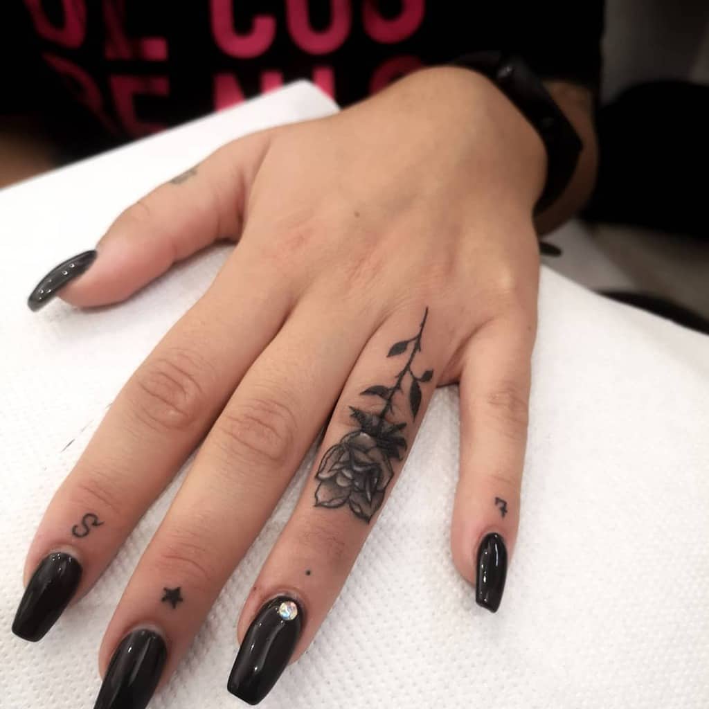 Delicate Flower Finger Tattoos alessandroverziera