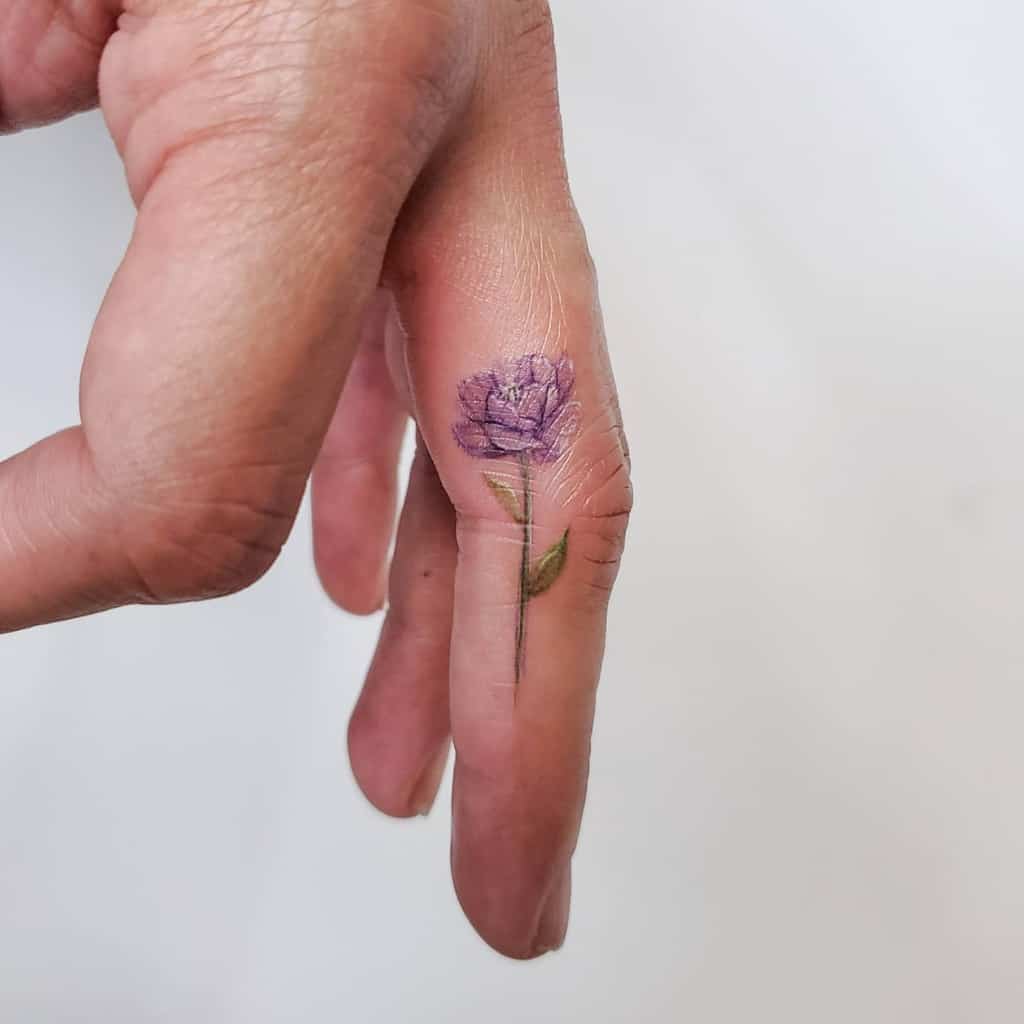 Delicate Flower Finger Tattoos sherriaustria