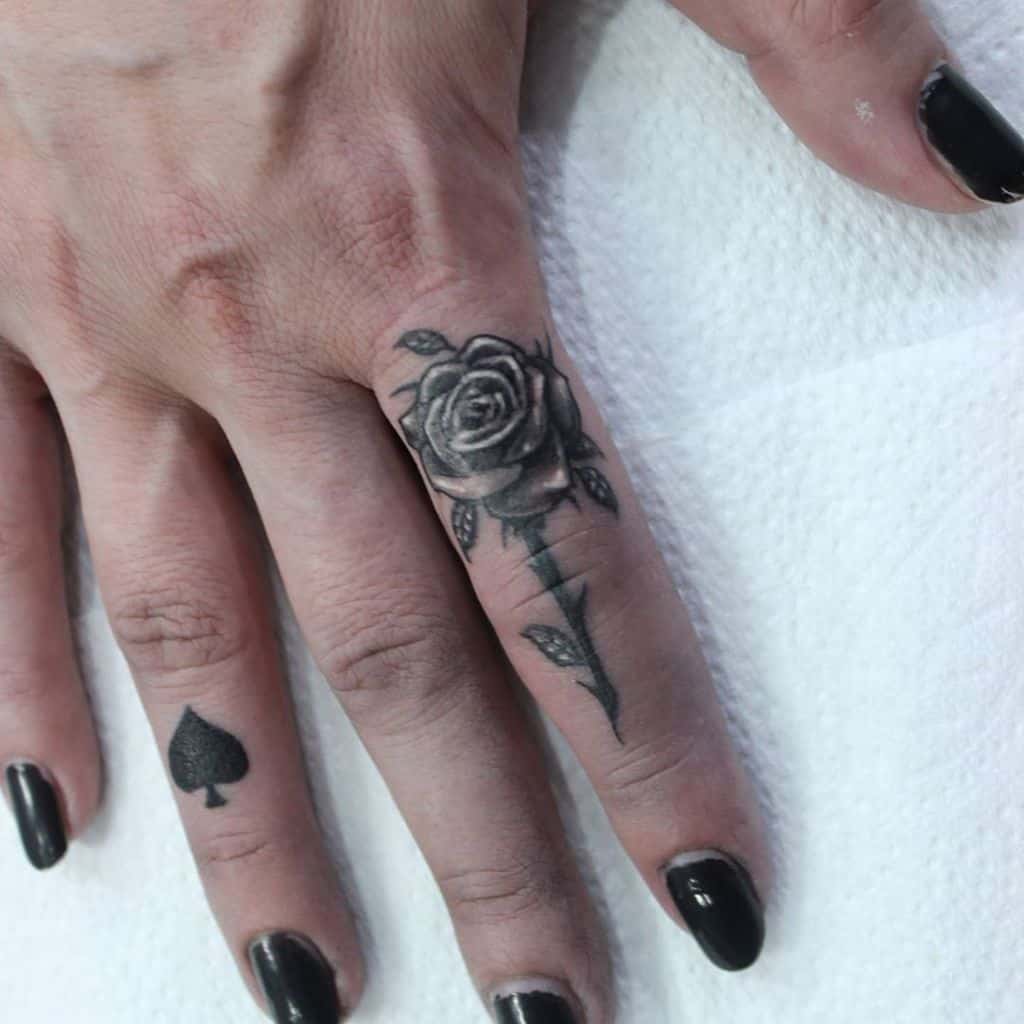 Delicate Flower Finger Tattoos sindjel_tattoo_piercing