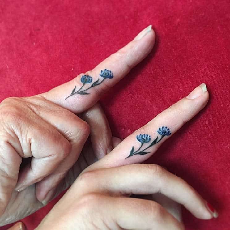Delicate Flower Finger Tattoos terran.tattooart_css