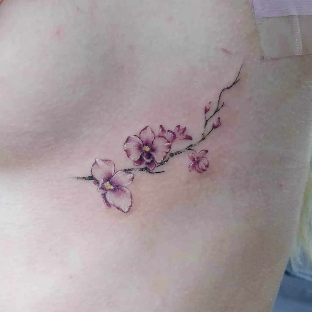 Delicate Flower Rib Tattoos deanna.adams_lostboytattoo721