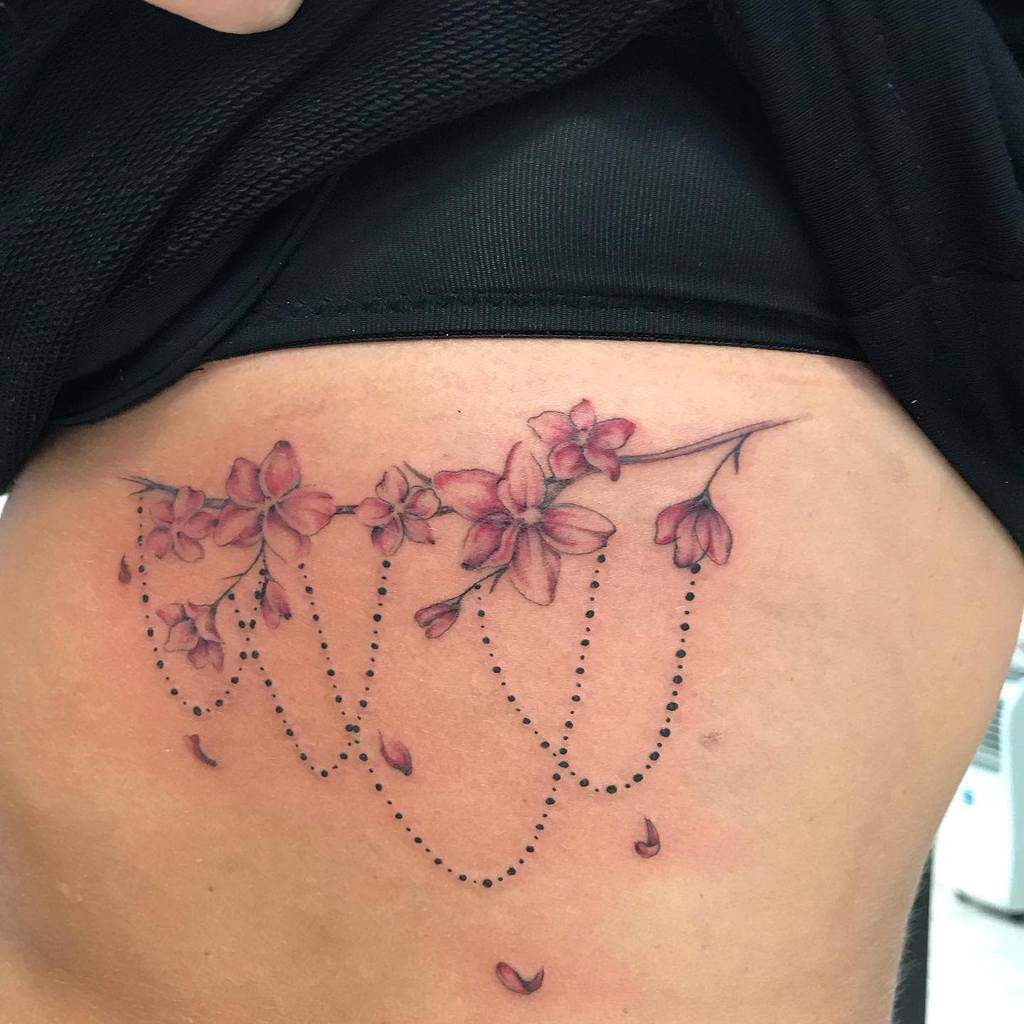Delicate Flower Rib Tattoos kedley_tattooist