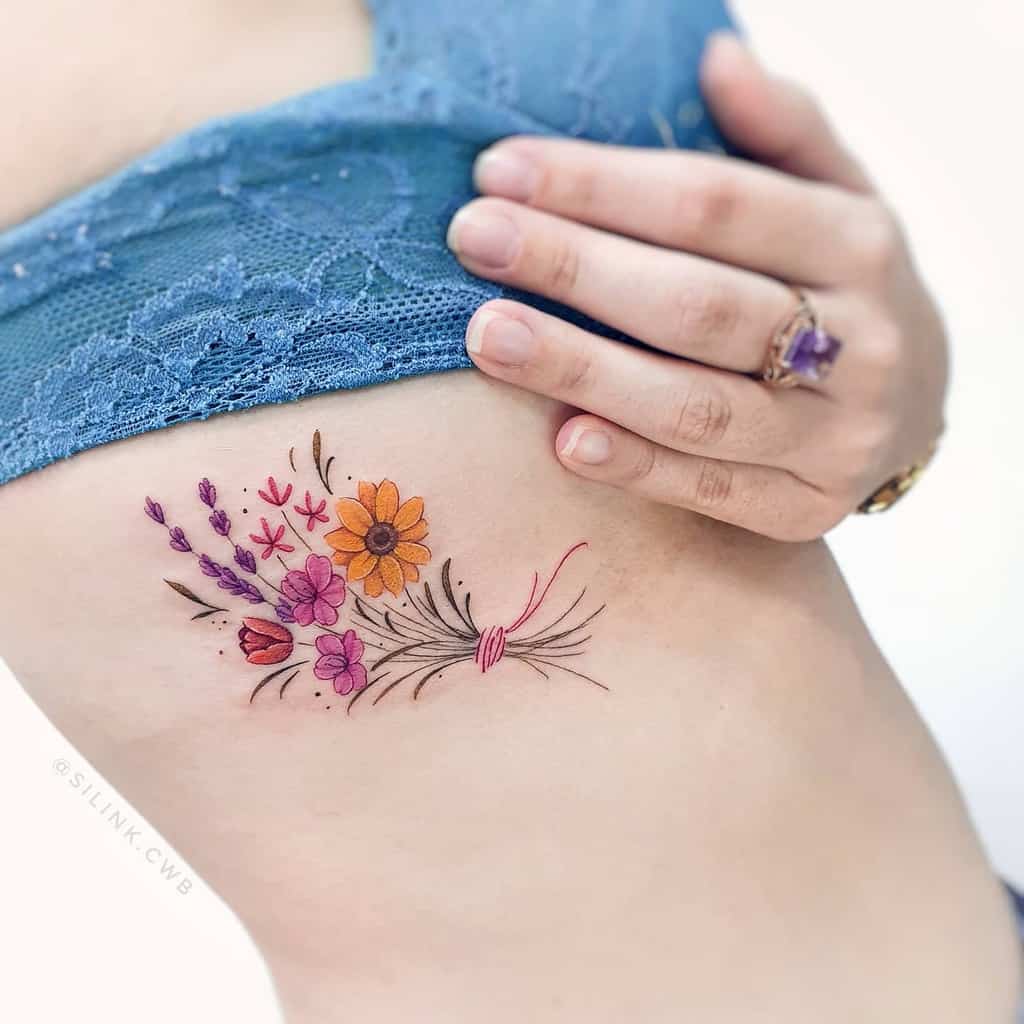 Delicate Flower Rib Tattoos silink.cwb