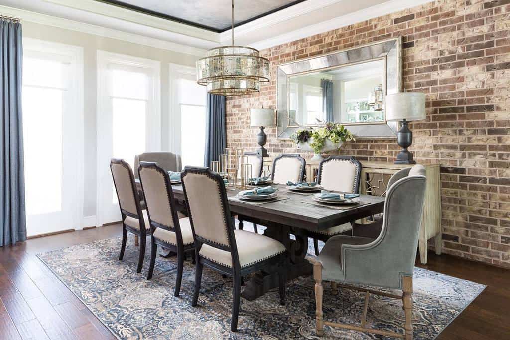 dining room with brick accent wall