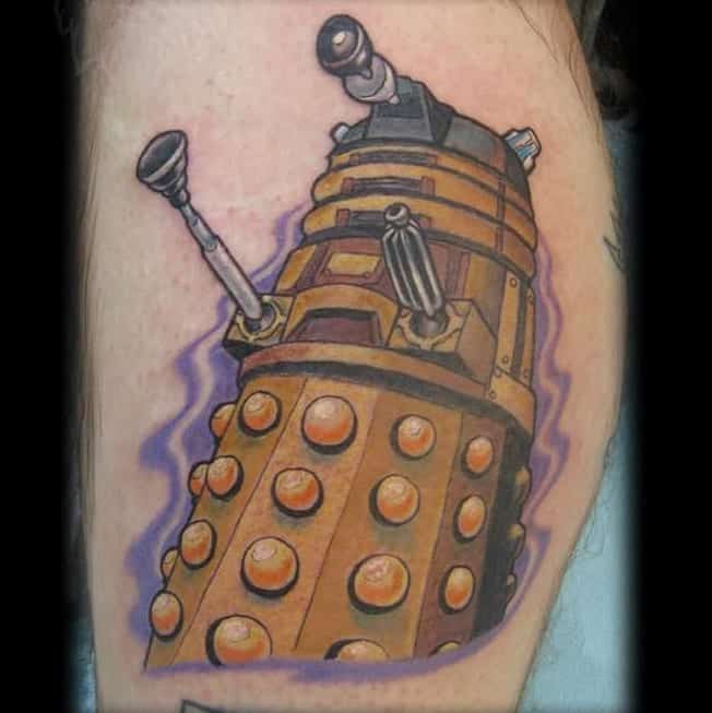 Colorful tattoo of a Dalek from 'Doctor Who', depicted in brown and gold tones with dynamic purple energy outlines