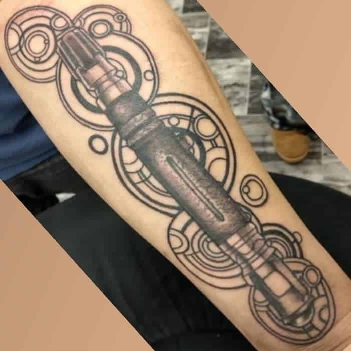 Doctor Who tattoo featuring a detailed Sonic Screwdriver surrounded by intricate Circular Gallifreyan patterns