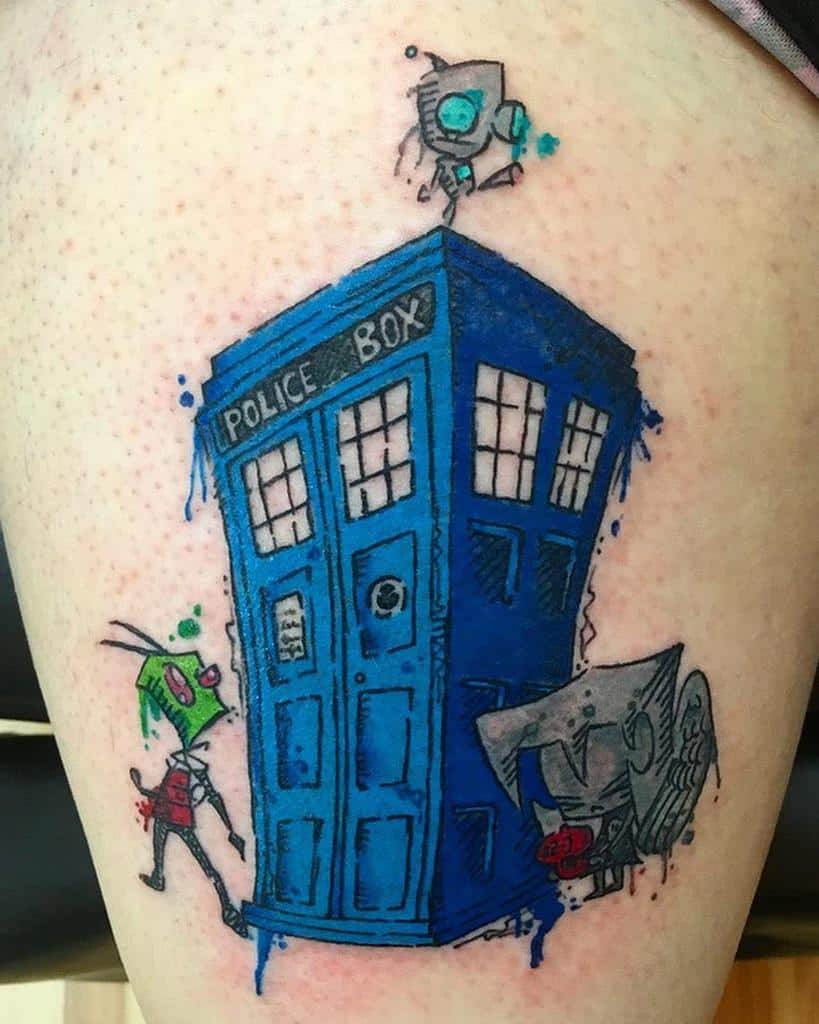 Colorful Doctor Who tattoo showing the TARDIS with cartoon-style Daleks, weeping Angel and Cybermen climbing around it, enhanced with blue splatters