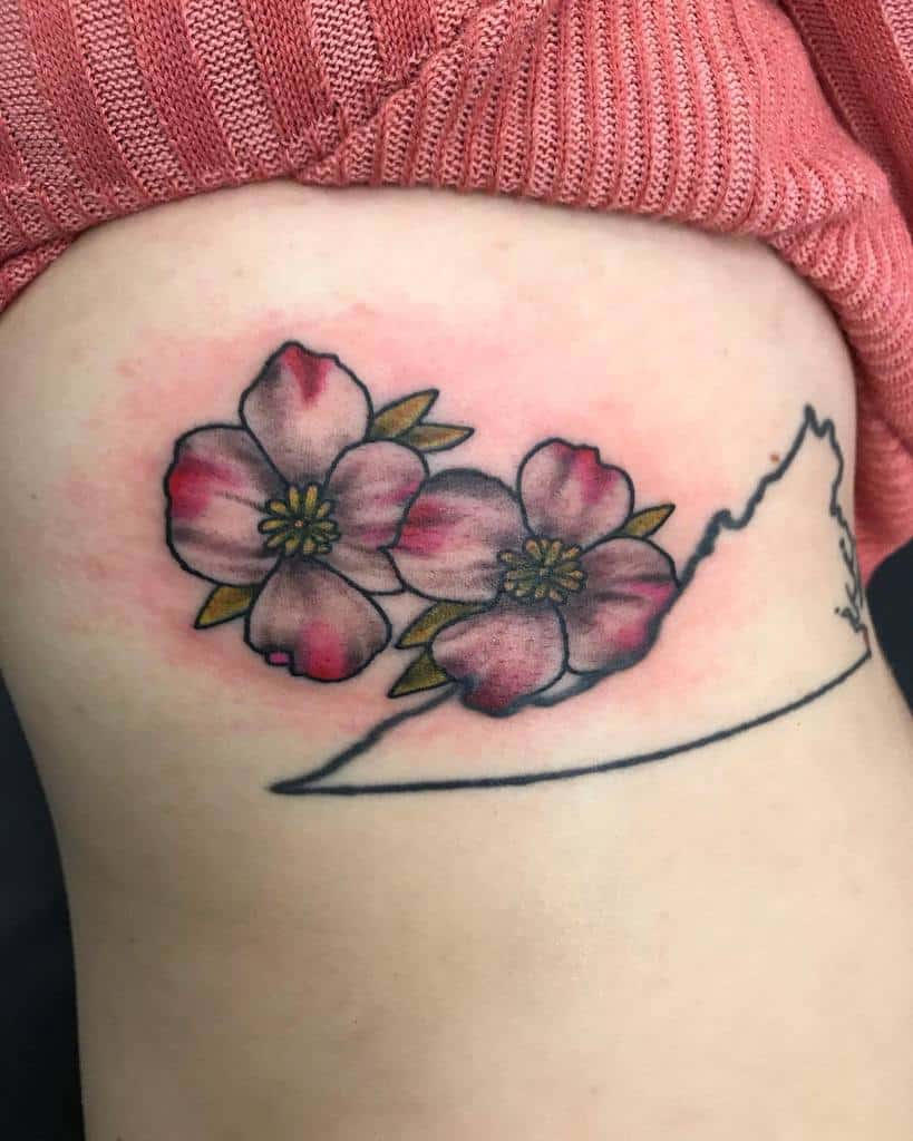 Tattoo of two pink dogwood flowers and an outline of a U.S. state