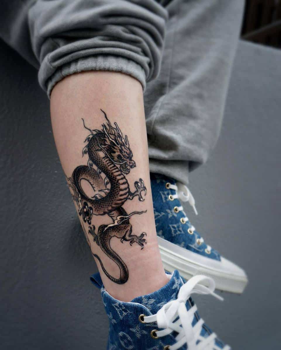 Tattoo of a detailed dragon on a leg
