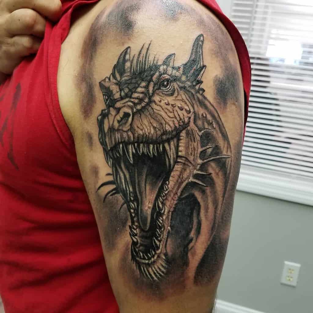 A tattoo of a roaring dragon on an upper arm