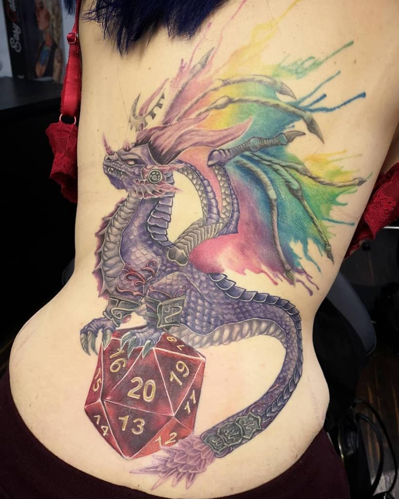 Vivid back dragon tattoo featuring a multicolored background and a large D20 dice