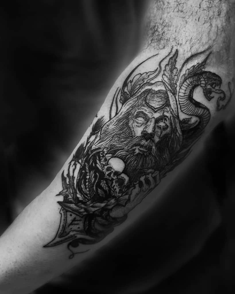 Intricate blackwork tattoo of a bearded druid with a serpent and skulls, evoking mystical D&D lore