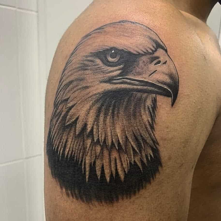 Tattoo of a detailed eagle head on a shoulder