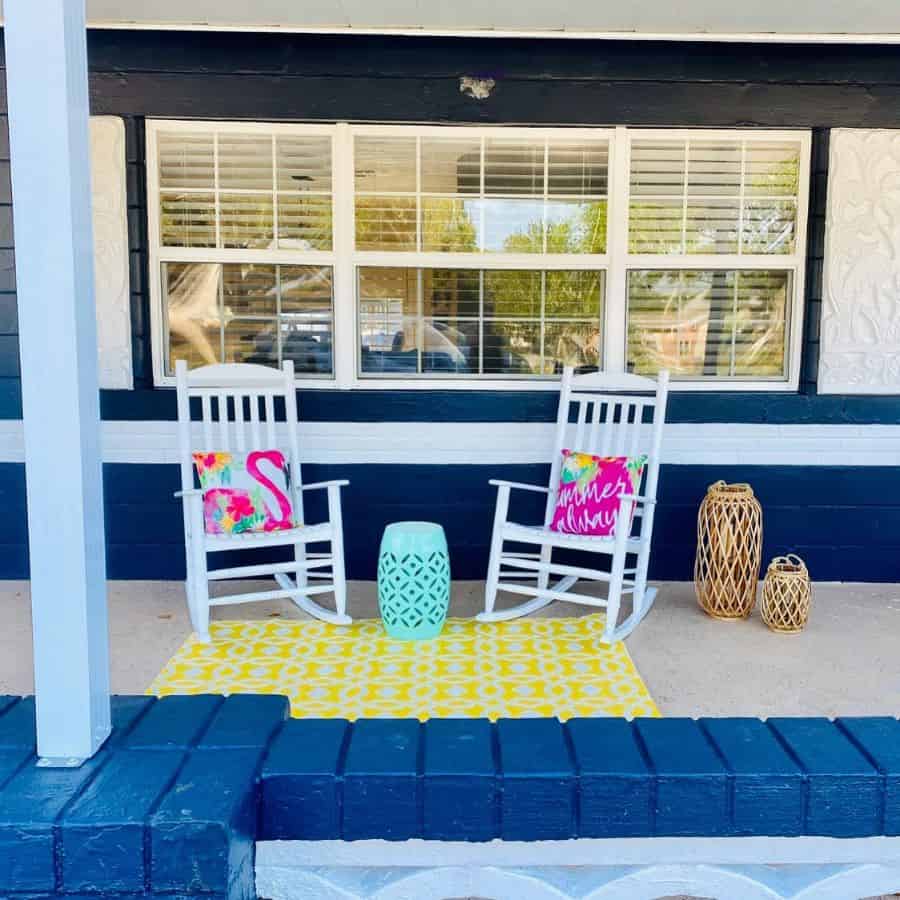 front porch patio with white rocking chairs 