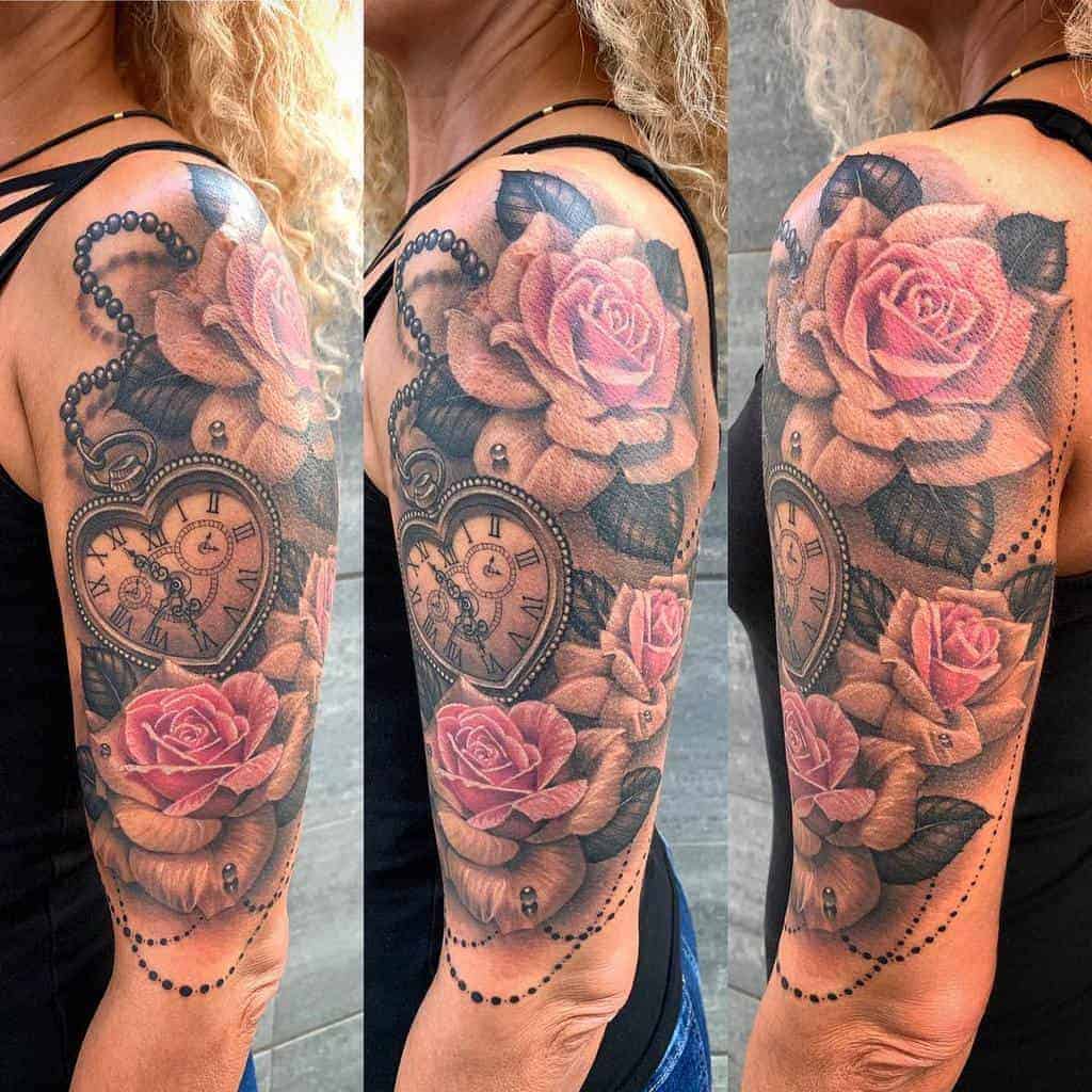 Detailed arm tattoo featuring roses, a clock, and beads on a woman's upper arm
