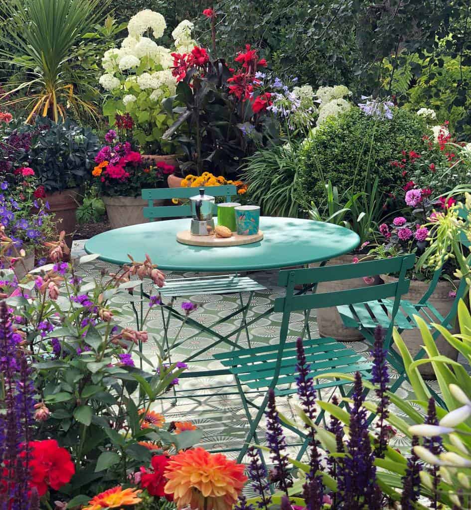 pattern tile patio garden with green table and chairs