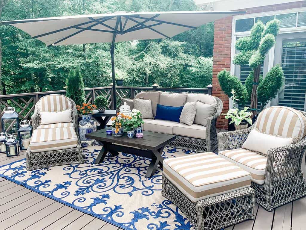 wood deck with umbrella and table and chairs 