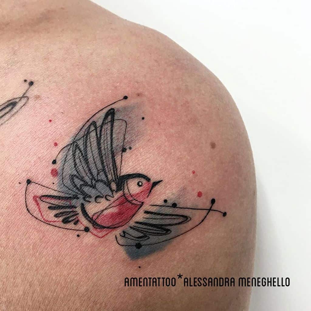Artistic flying robin tattoo featuring abstract lines and splashes of red and black