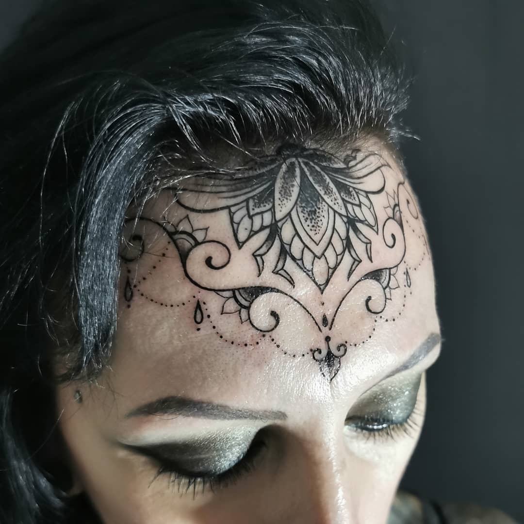 Ornamental Forehead Tattoo