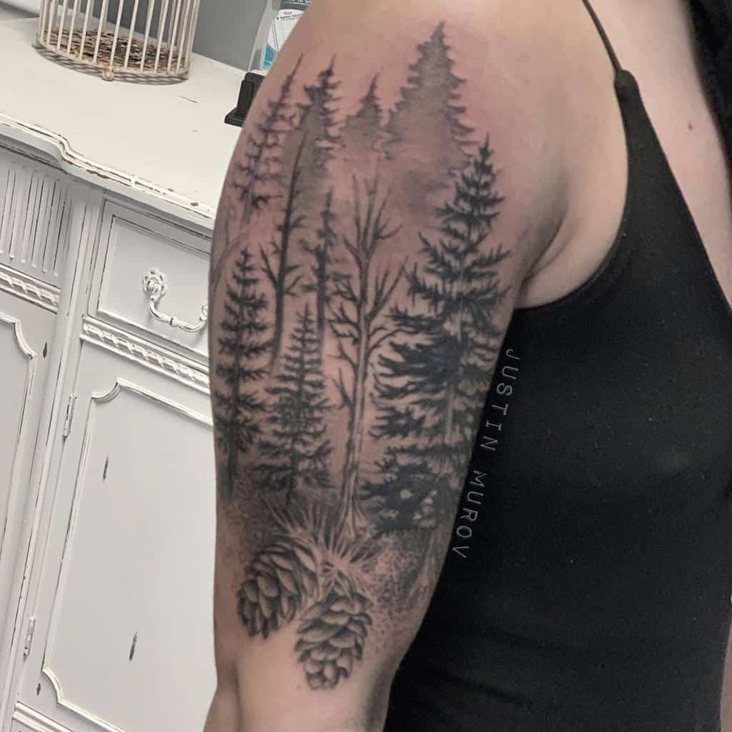 Upper arm tattoo of silhouetted pine trees and pine cones