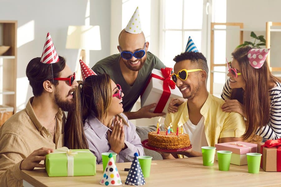 Friends congratulate man on his birthday