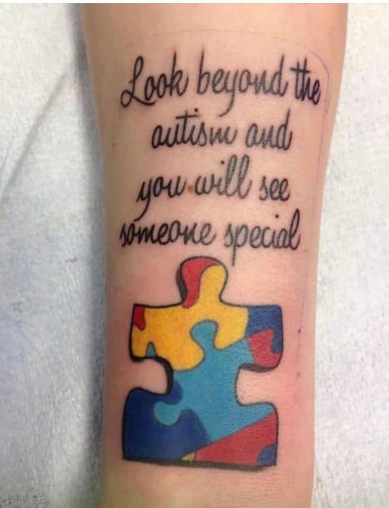Full color tattoo of Autism Awareness Puzzle piece with an inspirational quote.