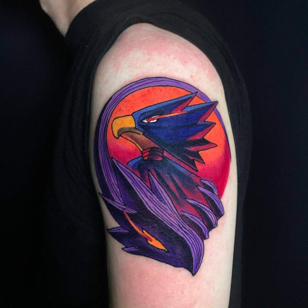 Bold and colorful tattoo of Fumikage Tokoyami from My Hero Academia, featuring his Dark Shadow quirk against a red and orange background