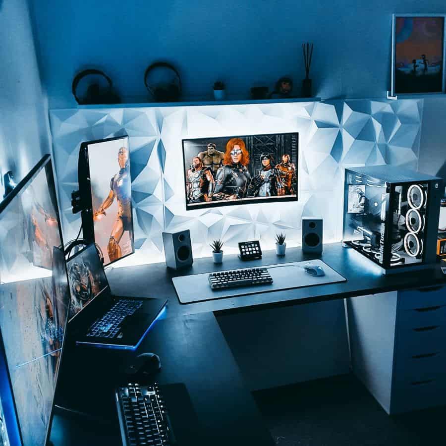 A gaming setup with multiple monitors, LED lights, and a gaming PC in a modern room