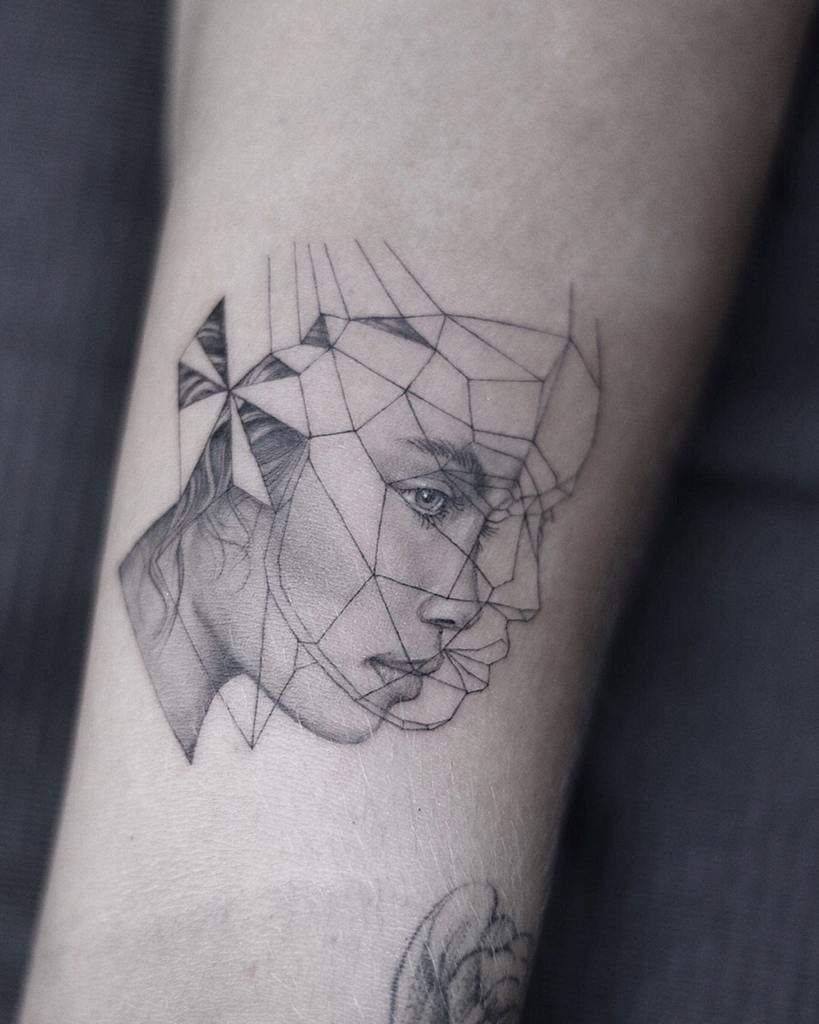 Geometric tattoo of a woman's face on forearm merging realistic and abstract styles meticulously crafted with single needle precision
