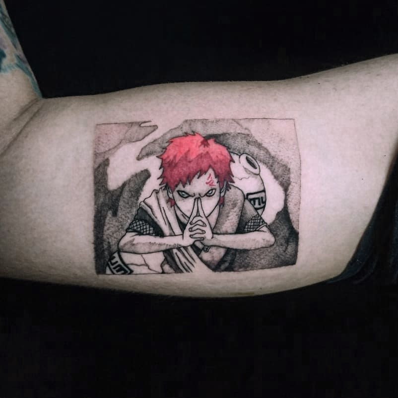 Tattoo of Gaara with red hair and a determined expression on an arm