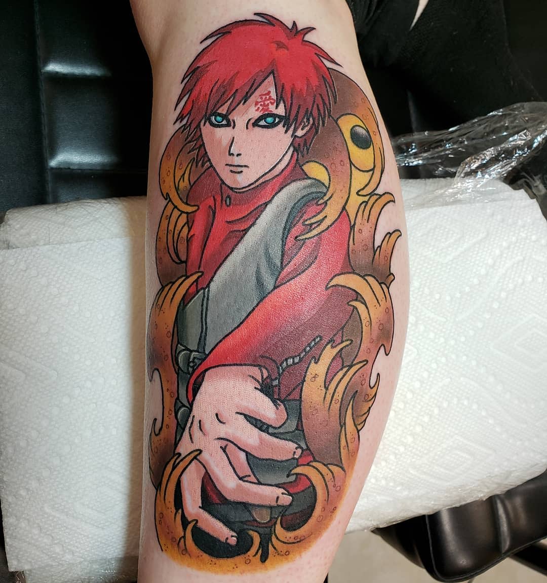 Tattoo of Gaara with red hair and a red outfit, surrounded by swirling designs