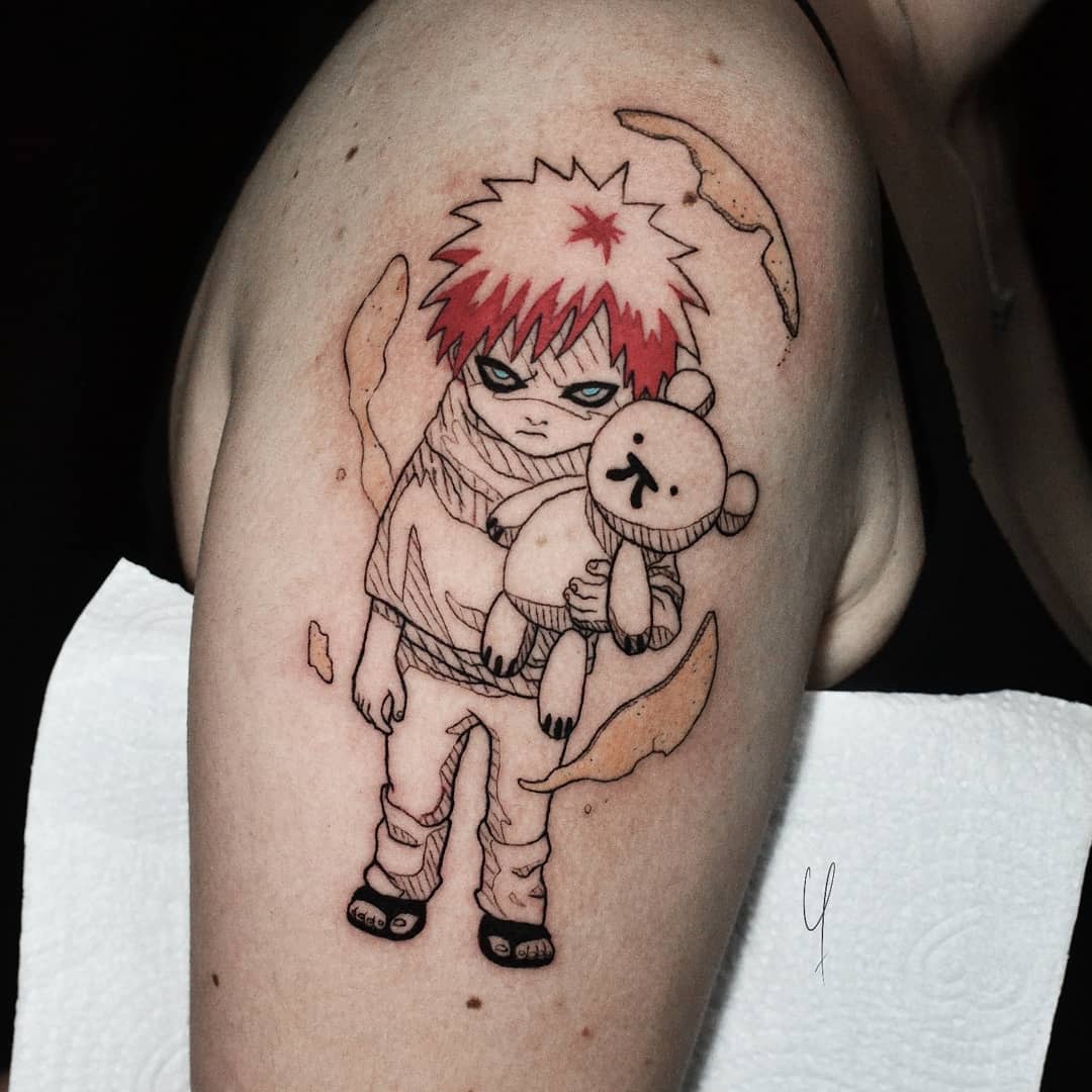 Tattoo of young Gaara with red hair holding a teddy bear on an arm