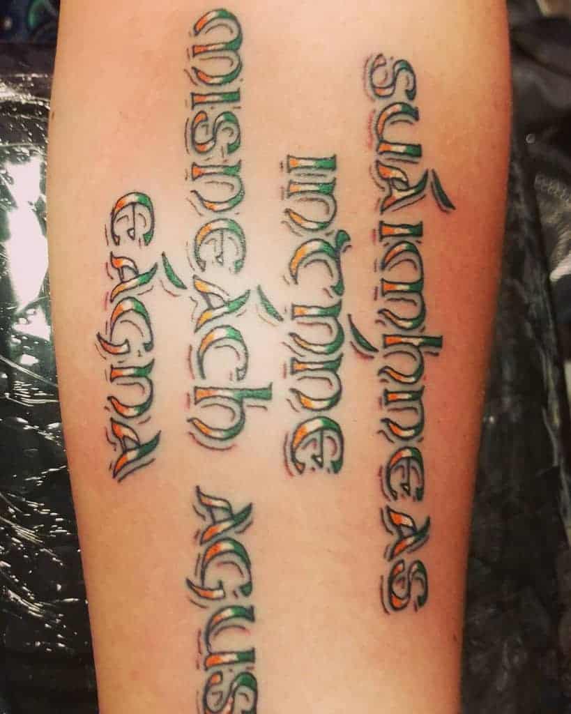 Gaelic Script Green White Ornage Tattoo