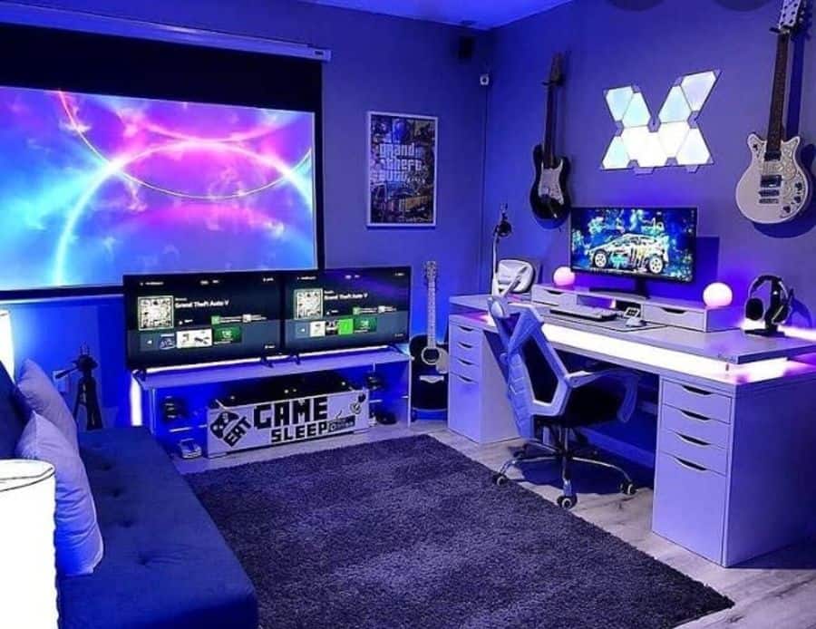 Modern gaming room with dual monitors, RGB lighting, guitars on walls, large screen, and comfortable chair