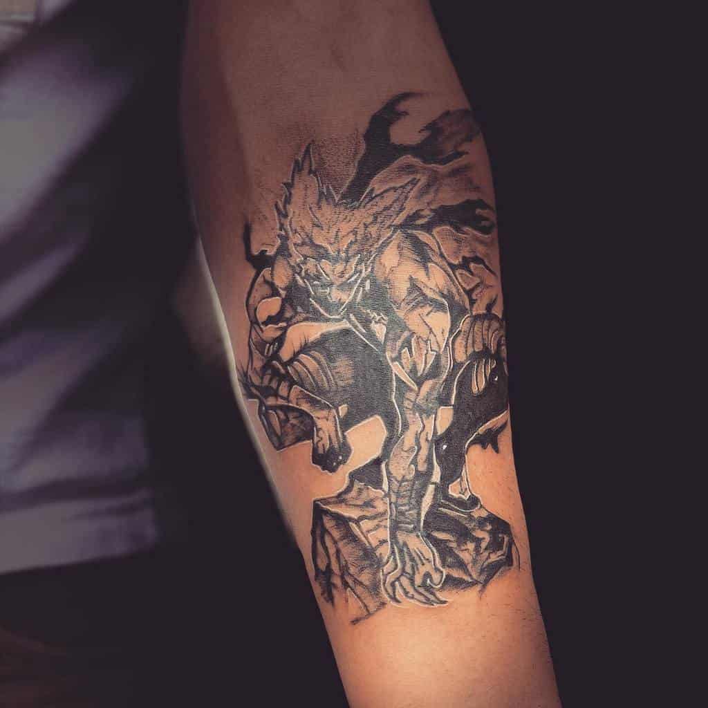 A black and gray tattoo of Garou from One Punch Man in a crouching battle stance, with intense shading and a dark energy aura