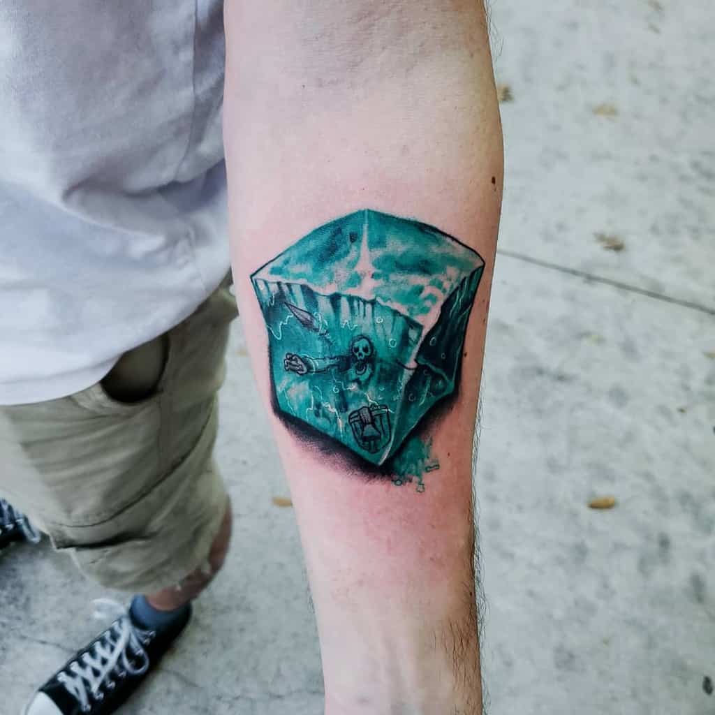 Bright and detailed tattoo of a gelatinous cube with trapped skeletons, a classic D&D monster