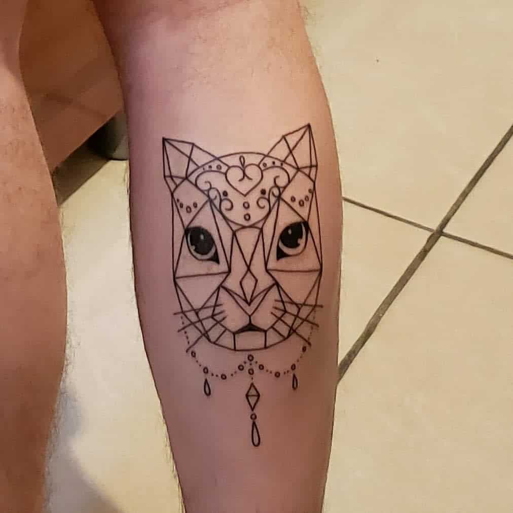 Geometric style cat tattoo on leg