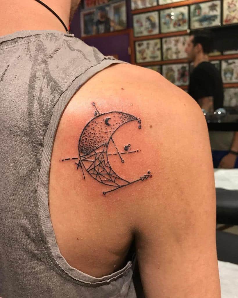 Crescent moon with geometric design tattoo on upper back shoulder