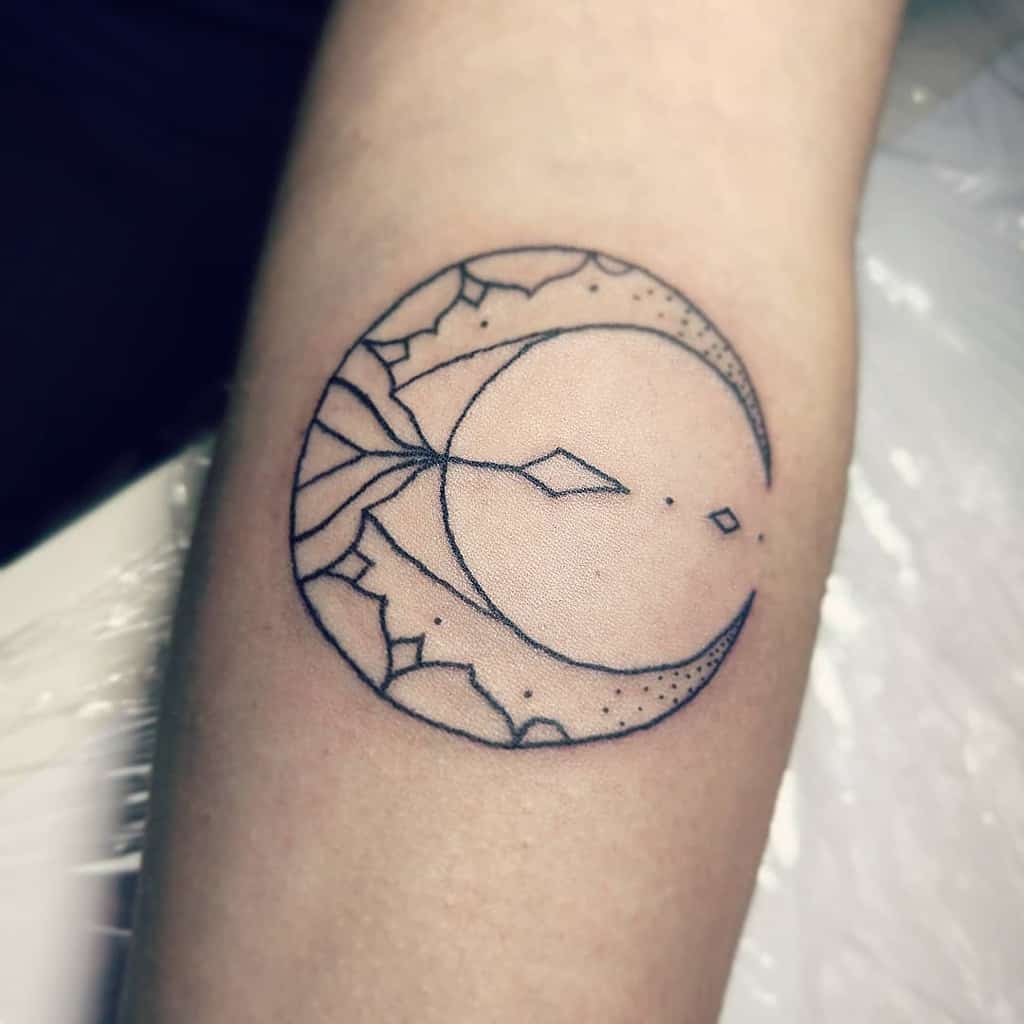 Tattoo of a geometric crescent moon with abstract line patterns gracefully adorning an arm