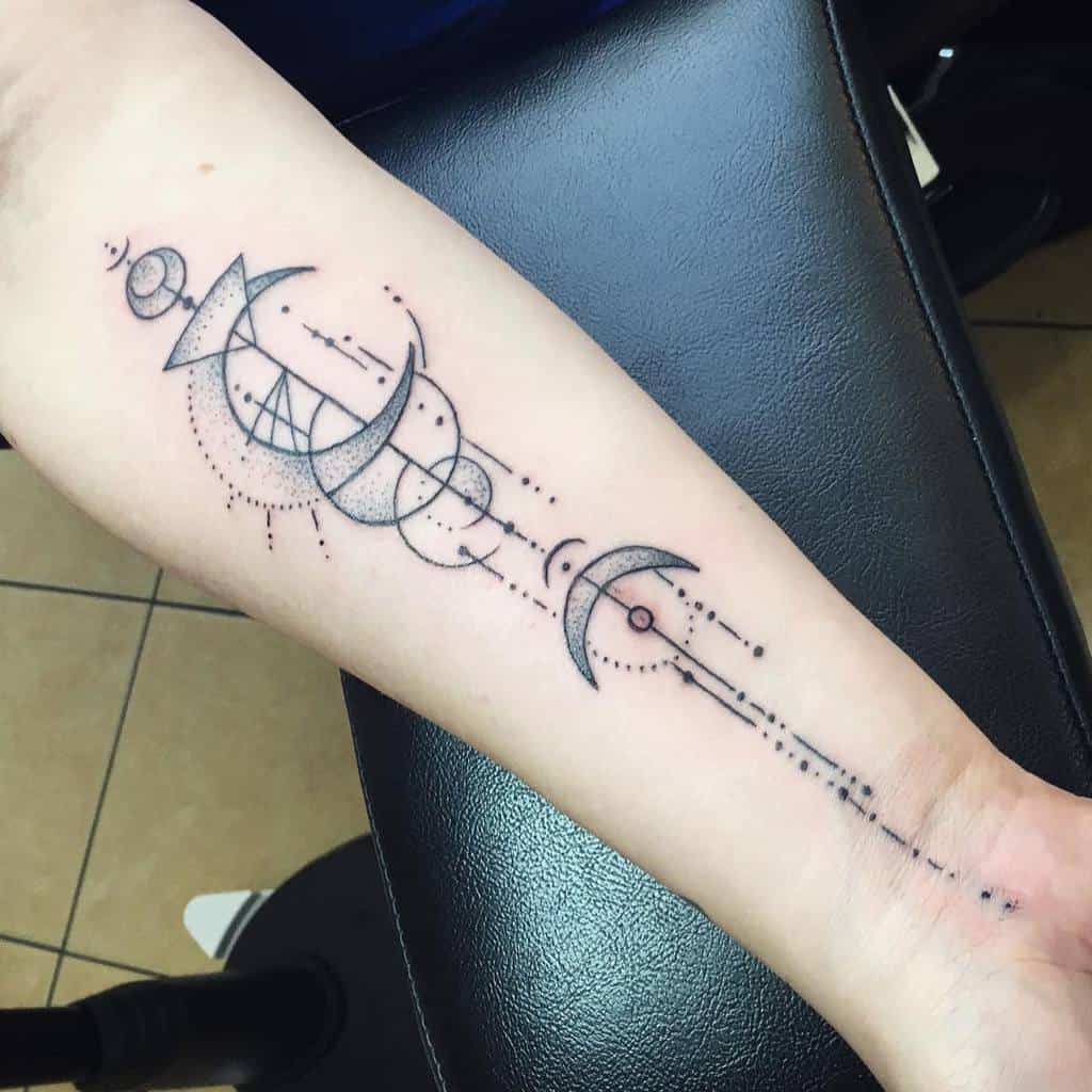 Forearm tattoo of geometric shapes intertwined with crescent moons aligned in a linear pattern