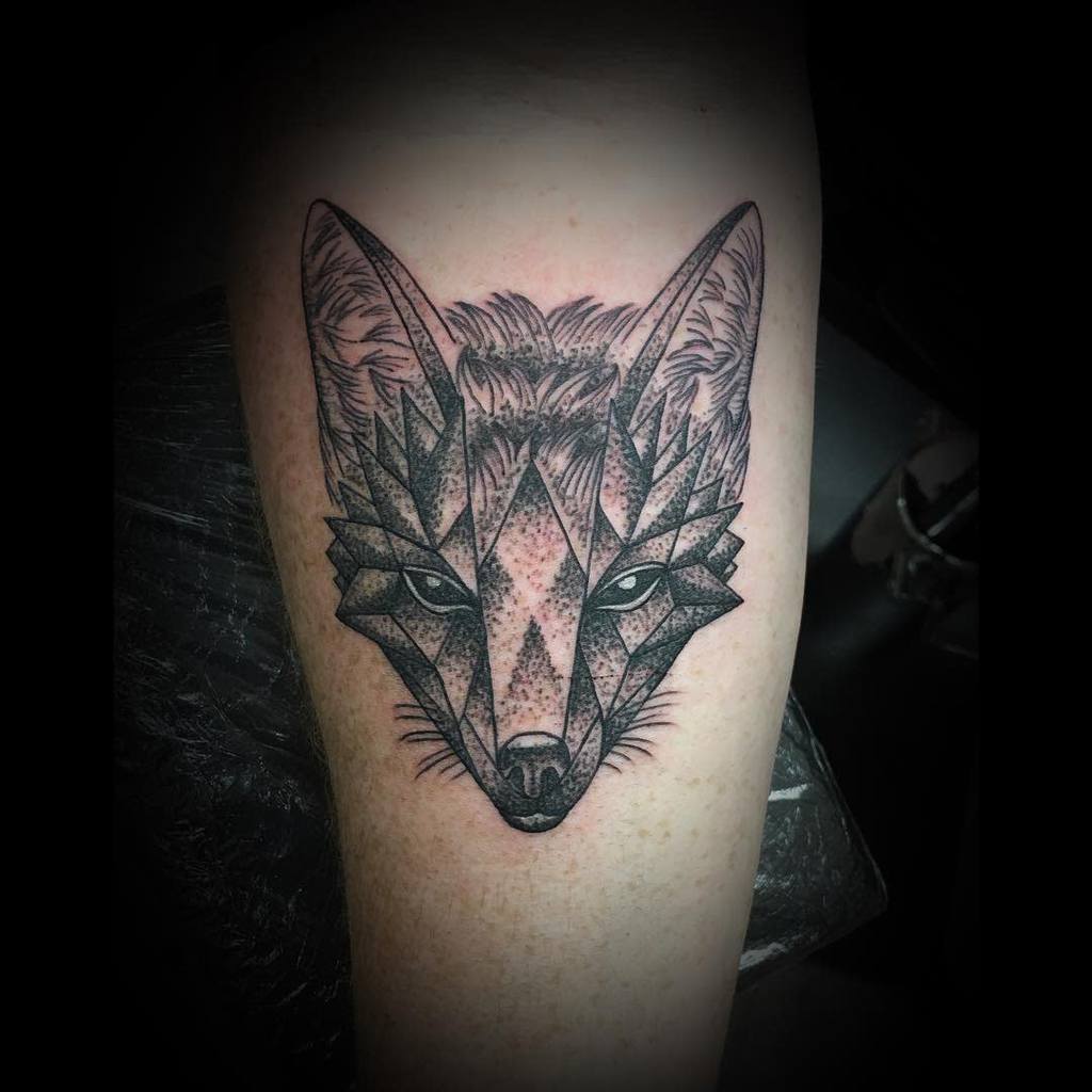 Geometric fox tattoo with intricate, striking details on the skin